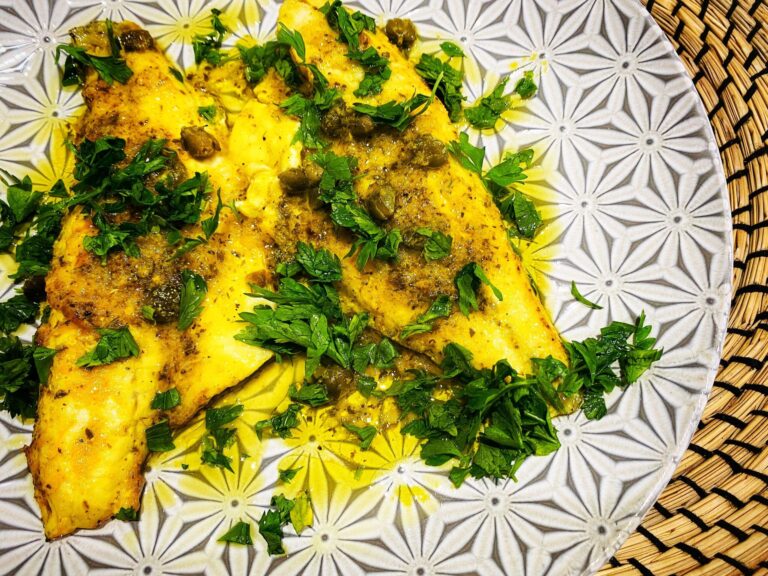 Filetti di Orata in salsa di arancio, burro ed erbe aromatiche